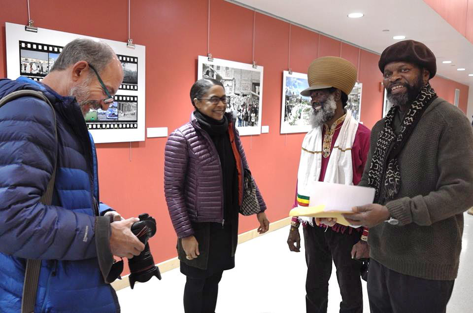 Tontongi, Doumafis Lafontan, Danielle Legros Georges, and a Boston Globe photographer.