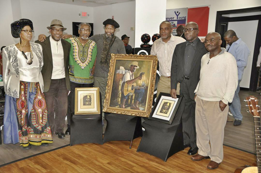 Raymond Justin, Yvon Lamour, Patrick Sylvain, Tontongi, Jean-Robert Boisrond, Charlot Lucien and Lunine Pierre-Jerôme at a commemoration ceremony for Manno Charlemagne.